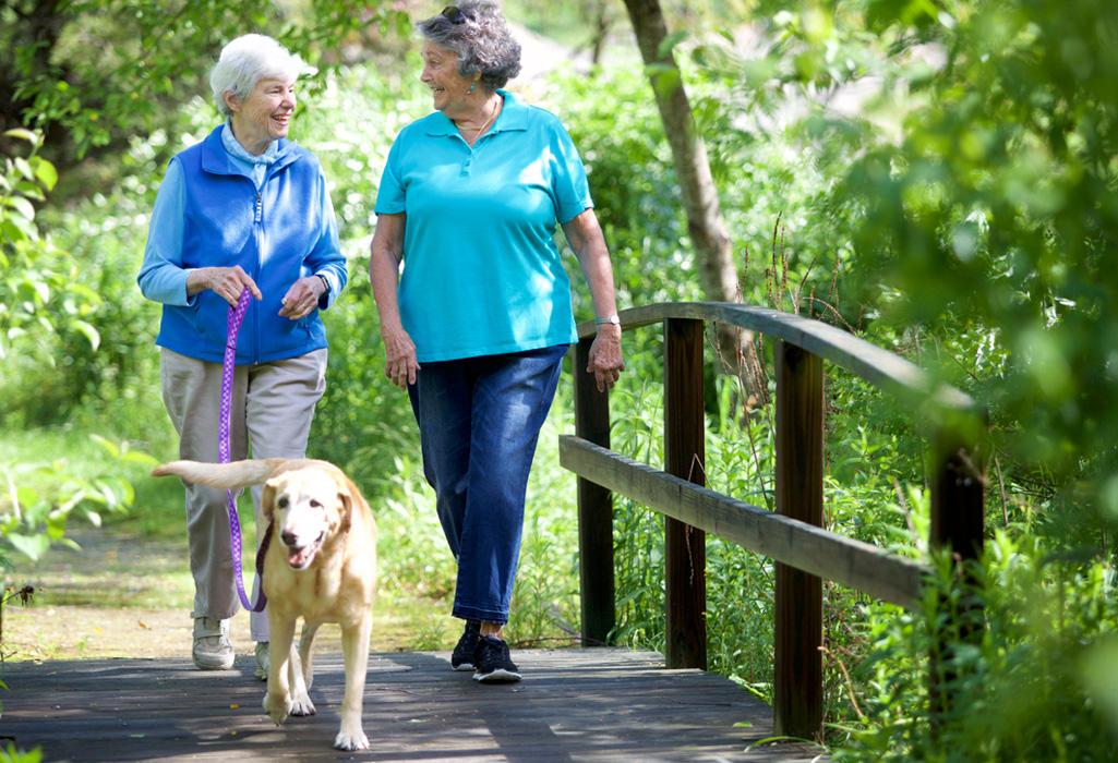 Two Independent Living residents of Riverwoods Exeter cycling the trails in Exeter, New Hampshire.