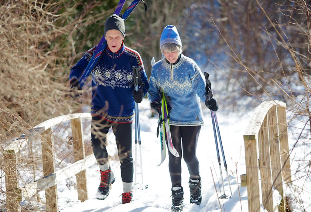 Two Independent Living residents of Riverwoods Exeter crosscountry skiing on the trails in Exeter, New Hampshire.