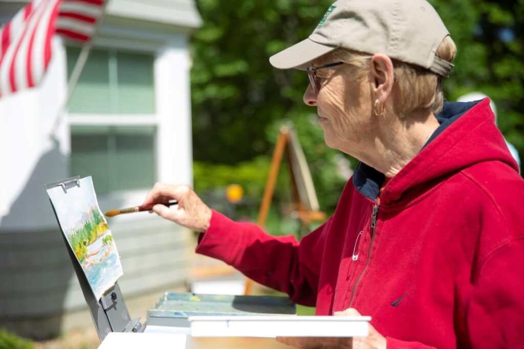 Independent Living resident painting at RiverWoods Exeter, New Hampshire
