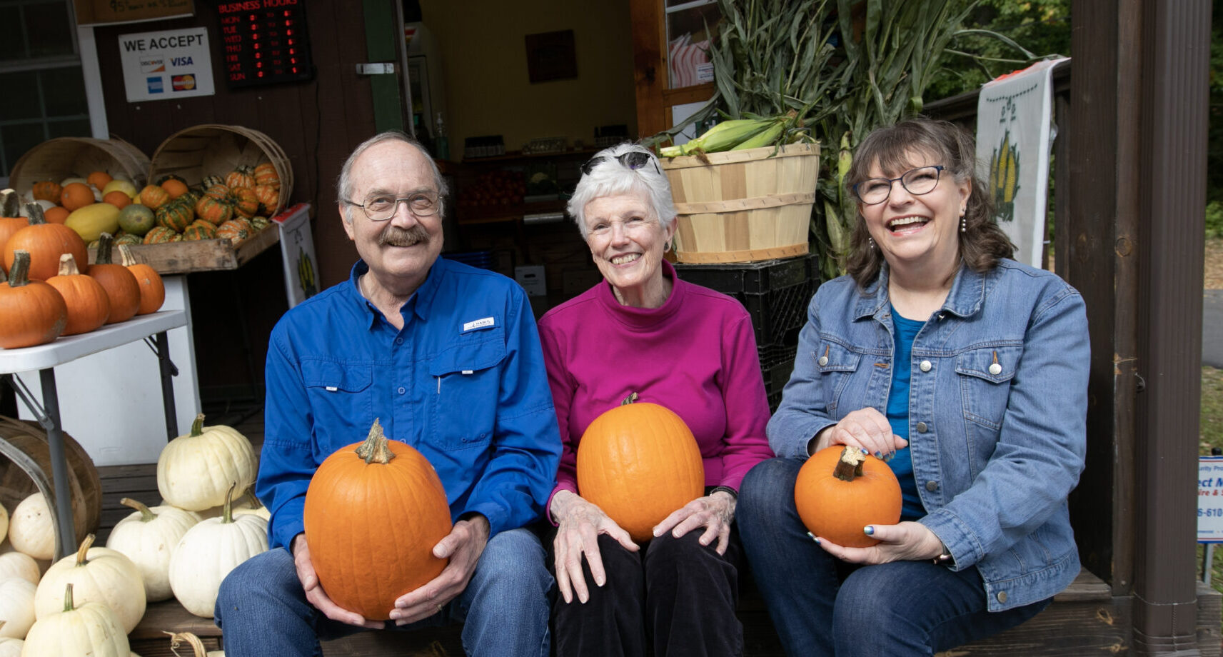 Three RiverWoods Manchester Independent Living residents with pumpkins in Manchester, New Hampshire