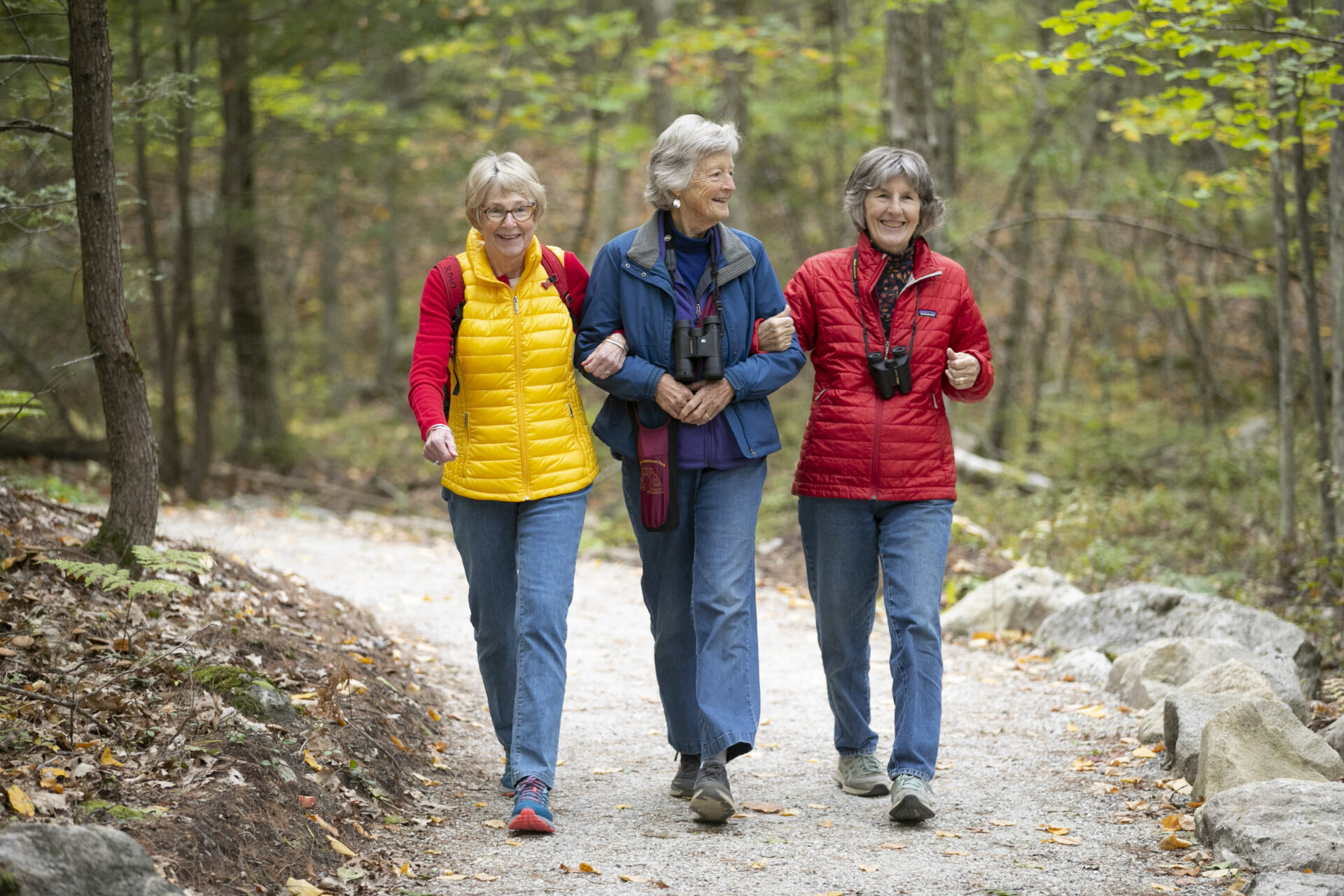 Three RiverWoods Durham Independent Living residents hiking the trails in Durham, New Hampshire